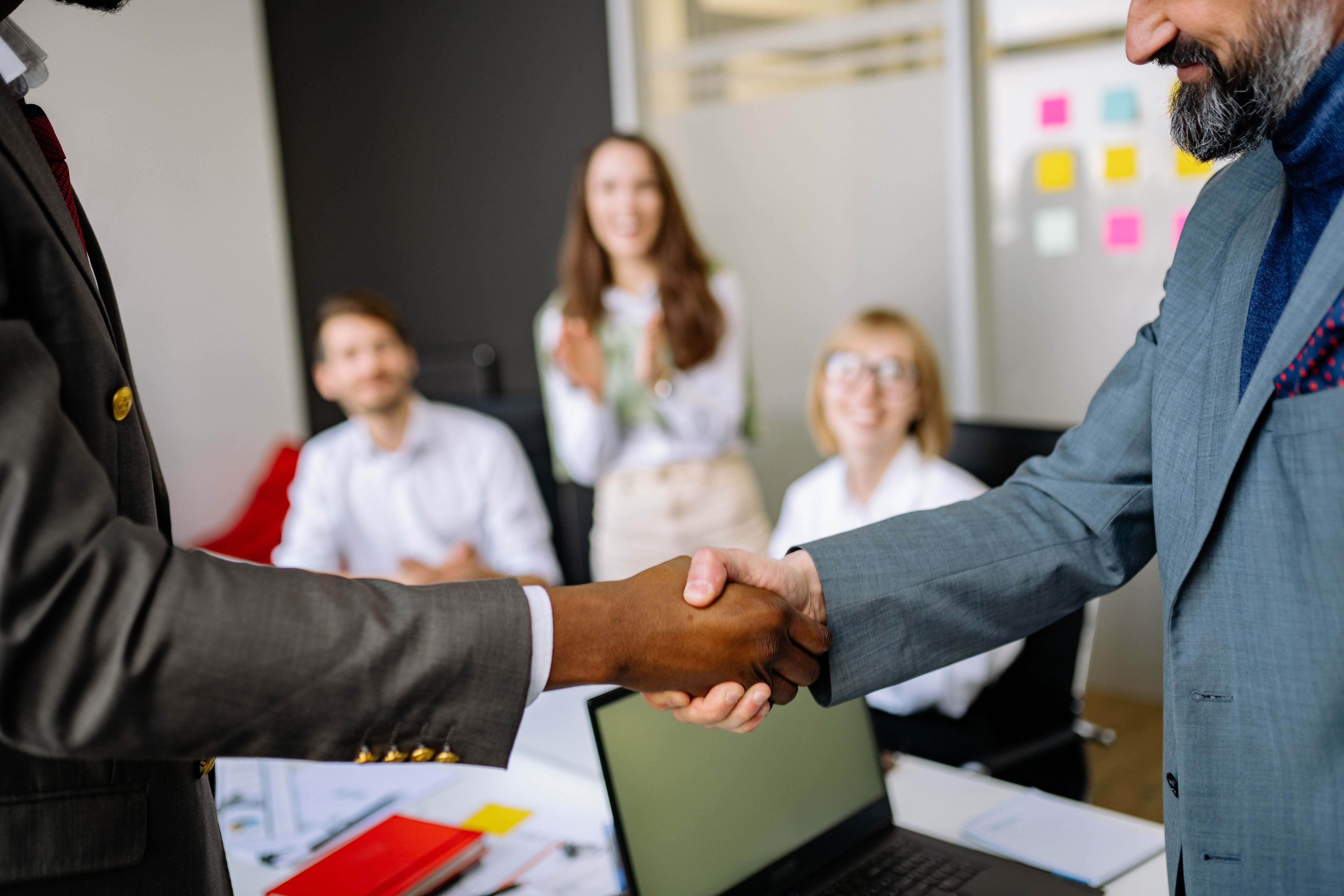 Close-up of a handshake between business colleagues emphasizing teamwork and relationship building